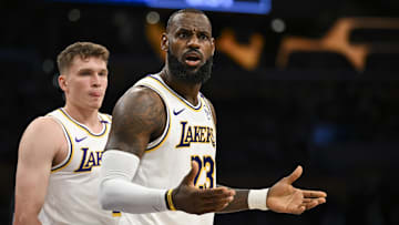 Oct 26, 2024; Los Angeles, California, USA; Los Angeles Lakers forward LeBron James (23) and guard Dalton Knecht (4) reacts to a ref’s call against the Sacramento Kings during the first half at Crypto.com Arena. Mandatory Credit: Jonathan Hui-Imagn Images