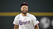 Jul 2, 2025; Arlington, Texas, USA; Detroit Pistons point guard Cade Cunningham reacts after he throws out the first pitch before the game between the Texas Rangers and the Baltimore Orioles at Globe Life Field. Mandatory Credit: Jerome Miron-Imagn Images