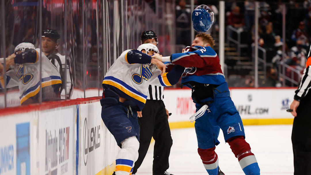 Colorado Avalanche captain Gabriel Landeskog fighting St. Louis Blues captain Brayden Schenn