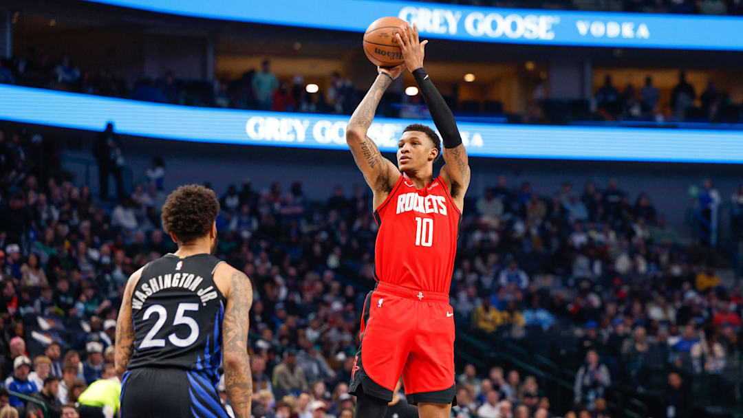 Dec 6, 2025; Dallas, Texas, USA; Houston Rockets forward Jabari Smith Jr. (10) shoots a jump shot over Dallas Mavericks forward P.J. Washington (25) during the first quarter at American Airlines Center. Mandatory Credit: Andrew Dieb-Imagn Images