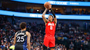 Dec 6, 2025; Dallas, Texas, USA; Houston Rockets forward Jabari Smith Jr. (10) shoots a jump shot over Dallas Mavericks forward P.J. Washington (25) during the first quarter at American Airlines Center. Mandatory Credit: Andrew Dieb-Imagn Images