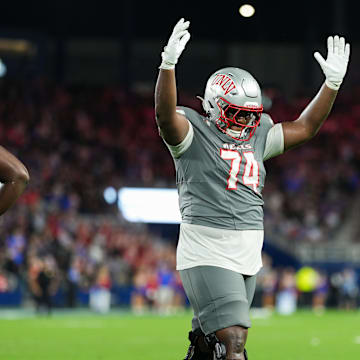 Sep 13, 2024; Kansas City, Kansas, USA; UNLV Rebels offensive lineman Jalen St. John (74) celebrates after the go-ahead touchdown late in the second half against the Kansas Jayhawks at Children's Mercy Park.