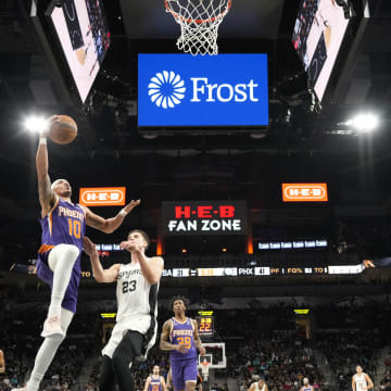 Jan 28, 2023; San Antonio, Texas, USA; Phoenix Suns guard Damion Lee (10) drives to the basket past San Antonio Spurs forward Zach Collins (23) during the first half at AT&T Center. Mandatory Credit: Scott Wachter-USA TODAY Sports