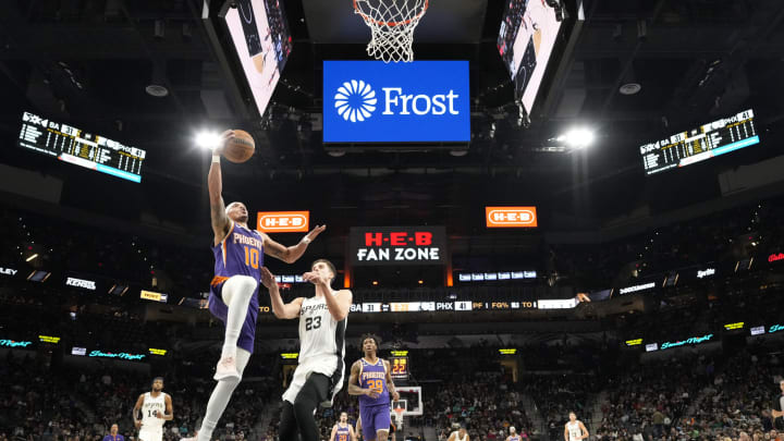Jan 28, 2023; San Antonio, Texas, USA; Phoenix Suns guard Damion Lee (10) drives to the basket past San Antonio Spurs forward Zach Collins (23) during the first half at AT&T Center. Mandatory Credit: Scott Wachter-USA TODAY Sports