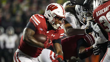 Nov 16, 2024; Madison, Wisconsin, USA;  Wisconsin Badgers running back Tawee Walker (3) rushes with the football during the first quarter against the Oregon Ducks at Camp Randall Stadium. Mandatory Credit: Jeff Hanisch-Imagn Images