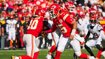 Sep 15, 2024; Kansas City, Missouri, USA; Kansas City Chiefs quarterback Patrick Mahomes (15) hands off to running back Isiah Pacheco (10) against the Cincinnati Bengals during the first half at GEHA Field at Arrowhead Stadium. Mandatory Credit: Denny Medley-Imagn Images