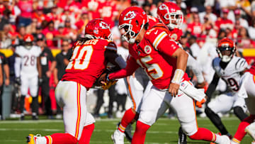 Sep 15, 2024; Kansas City, Missouri, USA; Kansas City Chiefs quarterback Patrick Mahomes (15) hands off to running back Isiah Pacheco (10) against the Cincinnati Bengals during the first half at GEHA Field at Arrowhead Stadium. Mandatory Credit: Denny Medley-Imagn Images