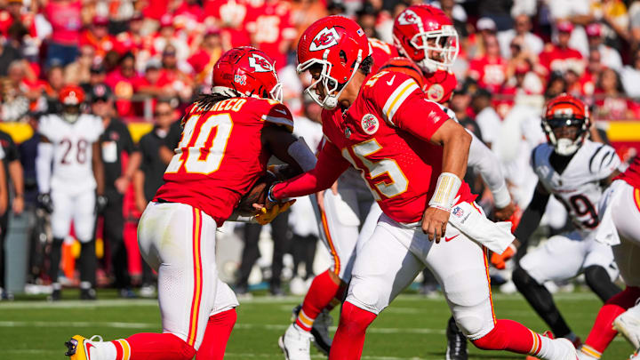 Sep 15, 2024; Kansas City, Missouri, USA; Kansas City Chiefs quarterback Patrick Mahomes (15) hands off to running back Isiah Pacheco (10) against the Cincinnati Bengals during the first half at GEHA Field at Arrowhead Stadium. Mandatory Credit: Denny Medley-Imagn Images