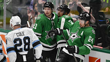 Apr 12, 2025; Dallas, Texas, USA; Dallas Stars left wing Jason Robertson (21) and defenseman Matt Dumba (3) and center Roope Hintz (24) celebrates a goal scored by Robertson against the Utah Hockey Club during the second period at the American Airlines Center. Mandatory Credit: Jerome Miron-Imagn Images