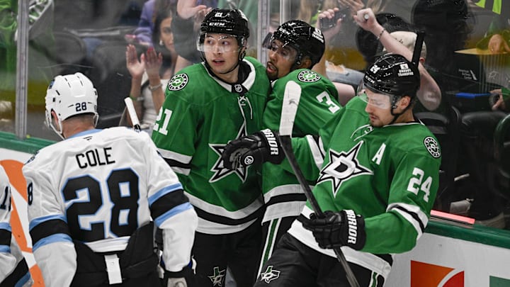 Apr 12, 2025; Dallas, Texas, USA; Dallas Stars left wing Jason Robertson (21) and defenseman Matt Dumba (3) and center Roope Hintz (24) celebrates a goal scored by Robertson against the Utah Hockey Club during the second period at the American Airlines Center. Mandatory Credit: Jerome Miron-Imagn Images