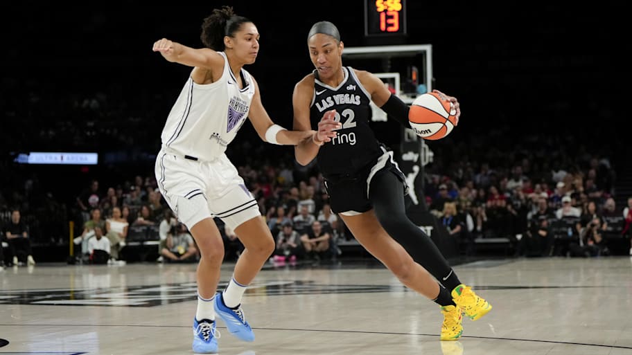 Aces center A'ja Wilson (22) dribbles the ball against Golden State Valkyries forward Janelle Salaun