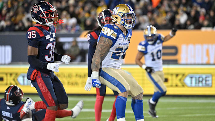 Nov 19, 2023; Hamilton, Ontario, CAN; Winnipeg Blue Bombers running back Brady Oliveira (20) celebrates after scoring a touchdown past Montreal Alouettes defensive back Reggie Stubblefield (35) in the first half at Tim Hortons Field. Mandatory Credit: Dan Hamilton-Imagn Images Nov 19, 2023; Hamilton, Ontario, CAN; Winnipeg Blue Bombers running back Brady Oliveira (20) celebrates after scoring a touchdown past Montreal Alouettes defensive back Reggie Stubblefield (35) in the first half at Tim Hortons Field. Mandatory Credit: Dan Hamilton-Imagn Images