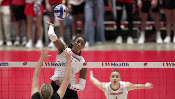 Wisconsin middle blocker Carter Booth hits the ball past UW-Milwaukee middle blocker Josie Noble during their volleyball match Tuesday, September 9, 2025 at the Wisconsin Field House in Madison, Wisconsin. Wisconsin beat UW-Milwaukee 3-0.