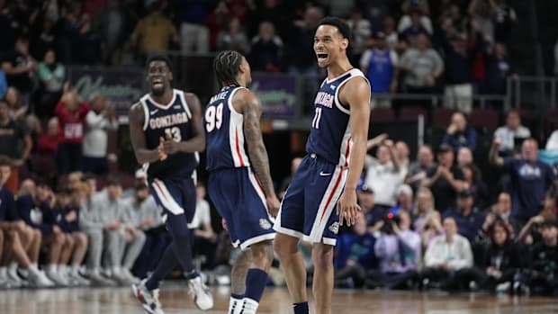 Gonzaga Bulldogs forward Graham Ike (13), guard Khalif Battle (99), and guard Nolan Hickman (11). 