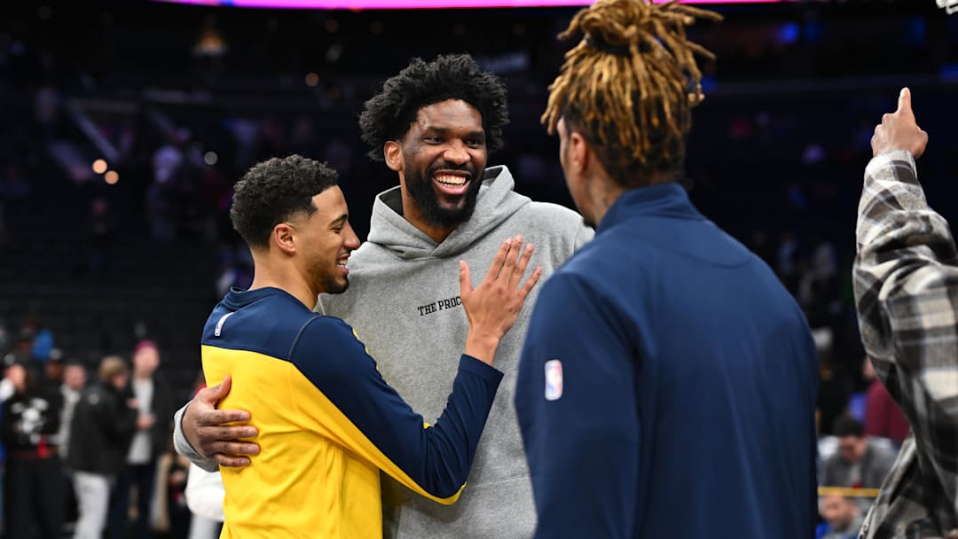 Mar 14, 2025; Philadelphia, Pennsylvania, USA; Philadelphia 76ers center Joel Embiid reacts with Indiana Pacers guard Tyrese Haliburton (left) and Indiana Pacers forward James Johnson (right) after the game at Wells Fargo Center. Mandatory Credit: Kyle Ross-Imagn Images