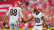 Sep 15, 2024; Kansas City, Missouri, USA; Cincinnati Bengals wide receiver Andrei Iosivas (80) celebrates with tight end Mike Gesicki (88) after an interception during the first half against the Kansas City Chiefs at GEHA Field at Arrowhead Stadium. Mandatory Credit: Jay Biggerstaff-Imagn Images