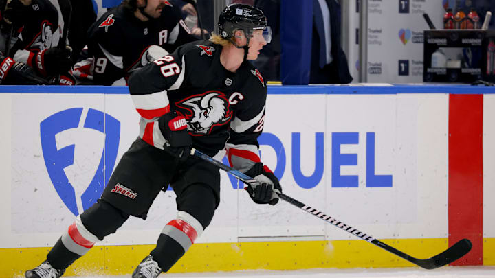 Nov 29, 2024; Buffalo, New York, USA;  Buffalo Sabres defenseman Rasmus Dahlin (26) looks to make a pass during the first period against the Vancouver Canucks at KeyBank Center. Mandatory Credit: Timothy T. Ludwig-Imagn Images