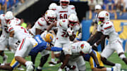 Sep 27, 2025; Pittsburgh, Pennsylvania, USA;  Louisville Cardinals running back Duke Watson (26) runs the ball against the Pittsburgh Panthers during the second quarter at Acrisure Stadium. Mandatory Credit: Charles LeClaire-Imagn Images