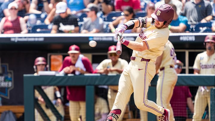 Jun 18, 2024; Omaha, NE, USA; Florida State Seminoles right fielder James Tibbs III (22) hits a double against the North Carolina Tar Heels during the fifth inning at Charles Schwab Field Omaha. 