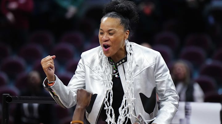 South Carolina women's basketball head coach Dawn Staley celebrates winning a national title with her team.