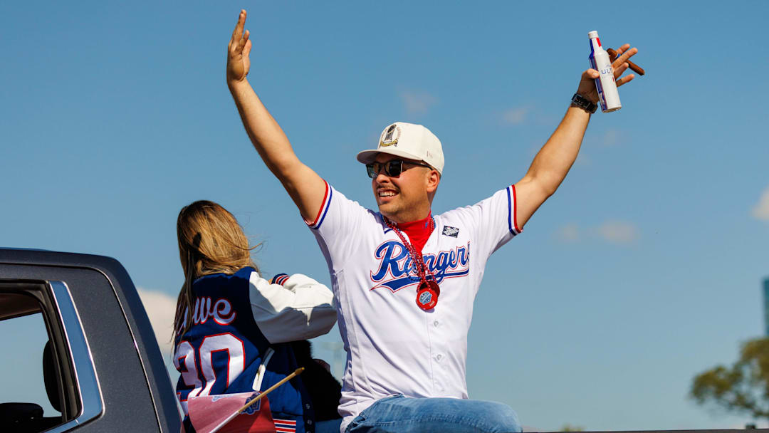 Nov 3, 2023; Arlington, TX, USA; Texas Rangers first baseman Nathaniel Lowe (30) acknowledges the fans during the World Series championship parade at Globe Life Field.  Mandatory Credit: Andrew Dieb-Imagn Images