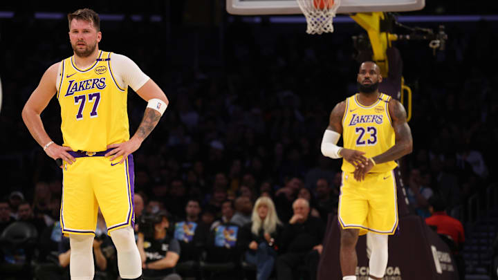 Los Angeles Lakers forward LeBron James (23) and guard Luka Doncic (77) during the first quarter against the Charlotte Hornets at Crypto.com Arena. 