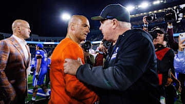 Nov 8, 2025; Lexington, Kentucky, USA; Kentucky Wildcats head coach Mark Stoops and Florida Gators interim head coach Billy Gonzales shake hands after the game at Kroger Field. Mandatory Credit: Jordan Prather-Imagn Images