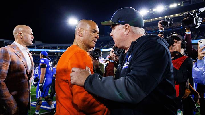 Nov 8, 2025; Lexington, Kentucky, USA; Kentucky Wildcats head coach Mark Stoops and Florida Gators interim head coach Billy Gonzales shake hands after the game at Kroger Field. Mandatory Credit: Jordan Prather-Imagn Images