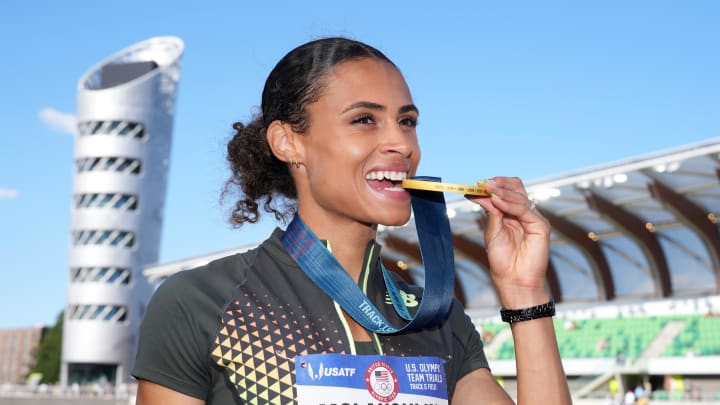 Jun 30, 2024; Eugene, OR, USA; Sydney McLaughlin-Levrone poses with gold medal after winning the women's 400m hurdles in a world record 50.65 during the US Olympic Team Trials at Hayward Field. 