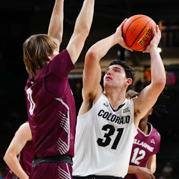 Dec 21, 2024; Boulder, Colorado, USA; Colorado Buffaloes guard Harrison Carrington (31) shoots the ball at Bellarmine Knights guard AJ Lux (0) in the second half at CU Events Center. Mandatory Credit: Ron Chenoy-Imagn Images