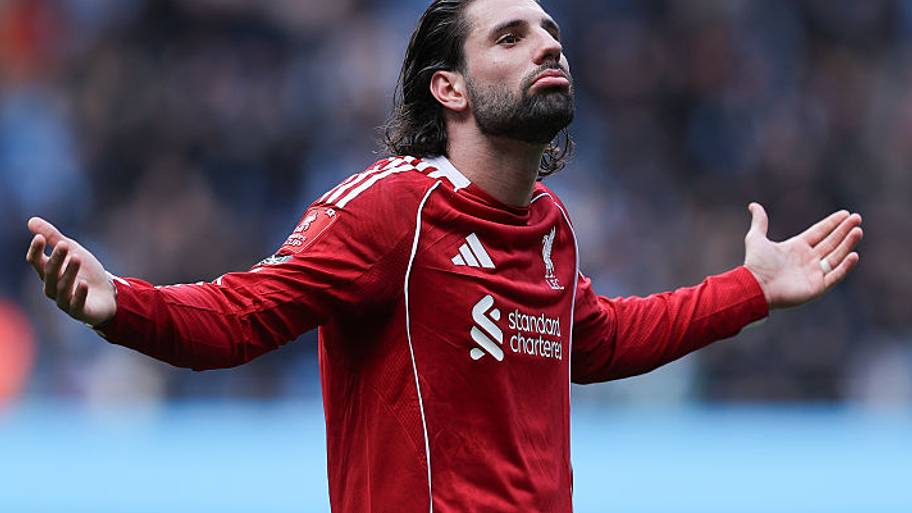 Dominik Szoboszlai gesturing to Liverpool supporters. 