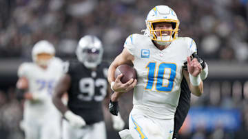 Jan 5, 2025; Paradise, Nevada, USA; Los Angeles Chargers quarterback Justin Herbert (10) carries the ball on a 41-yard run in the second half against the Las Vegas Raiders Allegiant Stadium.
