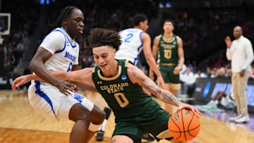 Mar 21, 2025; Seattle, WA, USA; Colorado State Rams guard Kyan Evans (0) attempts to drive the ball past Memphis Tigers guard Baraka Okojie (6) at Climate Pledge Arena. Mandatory Credit: Steven Bisig-Imagn Images