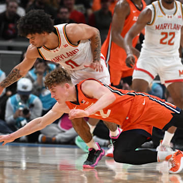 Mar 14, 2025; Indianapolis, IN, USA; Maryland Terrapins guard Ja'Kobi Gillespie (0) steals the ball from Illinois Fighting Illini guard Kasparas Jakucionis (32) during the first half at Gainbridge Fieldhouse. Mandatory Credit: Robert Goddin-Imagn Images