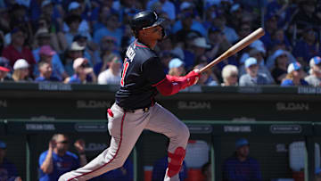 Mar 24, 2025; Mesa, Arizona, USA; Atlanta Braves shortstop Orlando Arcia (11) hits a single against the Chicago Cubs in the second inning at Sloan Park. 