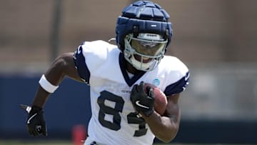 Jul 27, 2025; Oxnard, CA, USA; Dallas Cowboys wide receiver Kelvin Harmon (84) carries the ball at t training camp at the River Ridge Fields. Mandatory Credit: Kirby Lee-Imagn Images