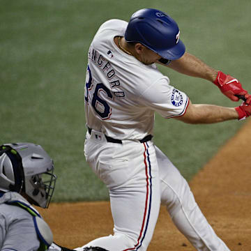 Sep 17, 2024; Arlington, Texas, USA; Texas Rangers left fielder Wyatt Langford (36) hits a ground run double against the Toronto Blue Jays during the first inning at Globe Life Field. Mandatory Credit: Jerome Miron-Imagn Images