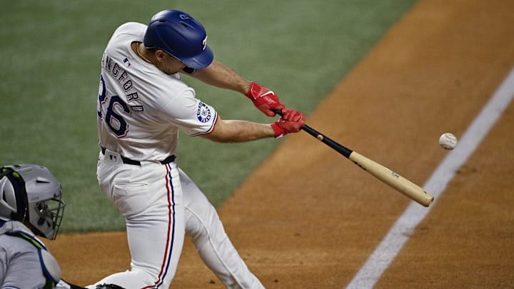 Sep 17, 2024; Arlington, Texas, USA; Texas Rangers left fielder Wyatt Langford (36) hits a ground run double against the Toronto Blue Jays during the first inning at Globe Life Field. Mandatory Credit: Jerome Miron-Imagn Images