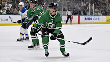 Dec 14, 2024; Dallas, Texas, USA; Dallas Stars center Roope Hintz (24) and defenseman Miro Heiskanen (4) in action during the game between the Dallas Stars and the St. Louis Blues at American Airlines Center. Mandatory Credit: Jerome Miron-Imagn Images