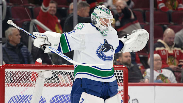 Feb 13, 2024; Chicago, Illinois, USA;  Vancouver Canucks goaltender Thatcher Demko (35) stretches before the start of a game against the Chicago Blackhawks at United Center. Mandatory Credit: Jamie Sabau-Imagn Images