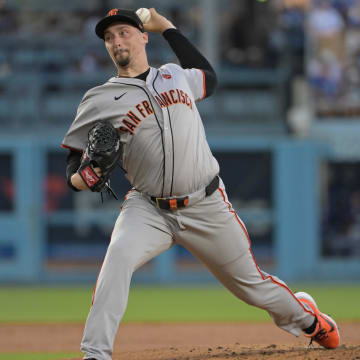 Jul 22, 2024; Los Angeles, California, USA;  San Francisco Giants starting pitcher Blake Snell (7) delivers to the plate in the second inning against the Los Angeles Dodgers at Dodger Stadium.