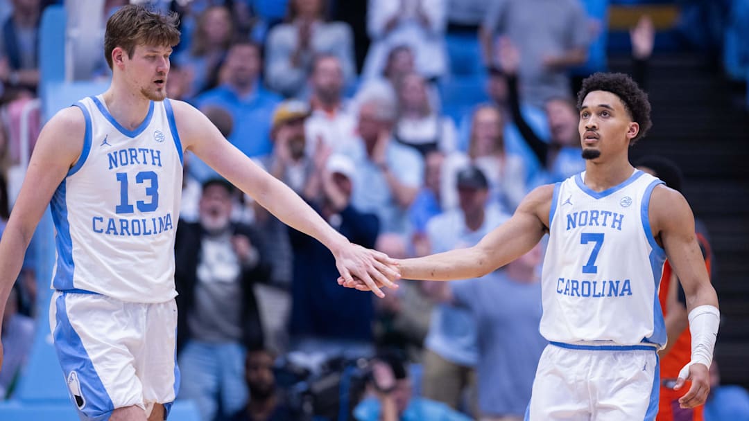 North Carolina Tar Heels center Henri Veesaar (13) celebrates with guard Seth Trimble (7) North Carolina Tar Heels center Henri Veesaar (13) celebrates with guard Seth Trimble (7)