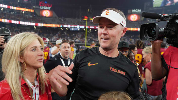 Sep 1, 2024; Paradise, Nevada, USA; Southern California Trojans head coach Lincoln Riley with wife Caitlin Riley after the game against the LSU Tigers at Allegiant Stadium. Mandatory Credit: Kirby Lee-USA TODAY Sports