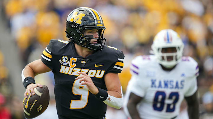 Sep 6, 2025; Columbia, Missouri, USA; Missouri Tigers quarterback Beau Pribula (9) rolls out to pass during the first half against the Kansas Jayhawks at Faurot Field at Memorial Stadium. Mandatory Credit: Jay Biggerstaff-Imagn Images