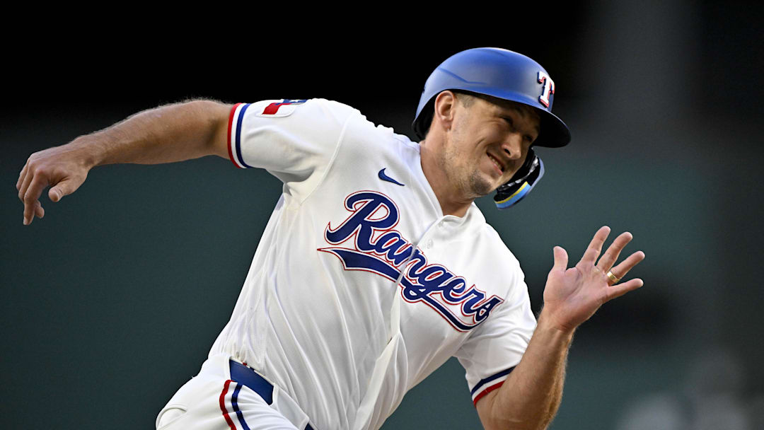 April 6, 2026; Arlington, Texas, USA; Texas Rangers left fielder Wyatt Langford (36) scores from second base during the first inning against the Seattle Mariners at Globe Life Field. Mandatory Credit: Jerome Miron-Imagn Images
