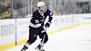 Penn State forward Aiden Fink skates with the puck in overtime against the Michigan Wolverines during their Big Ten Tournament quarterfinal series at Yost Arena.