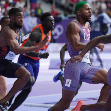 Aug 8, 2024; Saint-Denis, FRANCE; Courtney Lindsey (USA) takes the baton from Kyree King (USA) in the women's 4x100m relay round 1 heats during the Paris 2024 Olympic Summer Games at Stade de France. Mandatory Credit: Kirby Lee-USA TODAY Sports