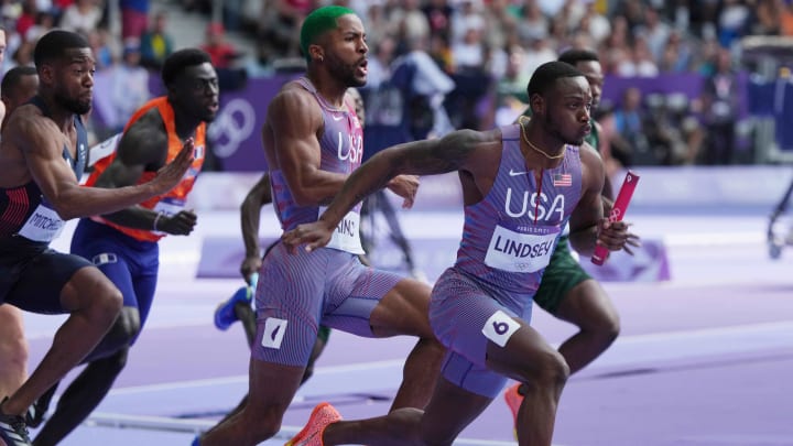 Aug 8, 2024; Saint-Denis, FRANCE; Courtney Lindsey (USA) takes the baton from Kyree King (USA) in the women's 4x100m relay round 1 heats during the Paris 2024 Olympic Summer Games at Stade de France. Mandatory Credit: Kirby Lee-USA TODAY Sports