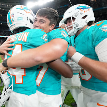 Miami Dolphins wide receiver Tahj Washington (84) congratulates place kicker Riley Patterson (47) after the 2025 NFL Madrid Game against the Washington Commanders at Santiago Bernabeu Stadium.