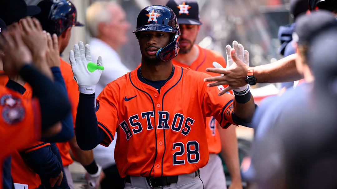 Houston Astros second baseman Brice Matthews (28) is greeted by teammates after hitting a home run during the fifth inning against the Los Angeles Angels at Angel Stadium.